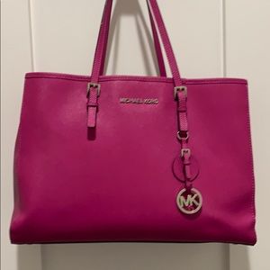 Michael Kors hot pink bag.